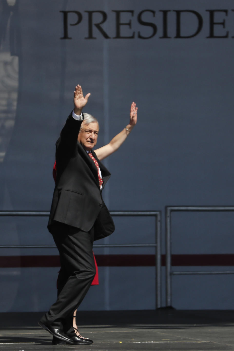 Mexico's President Andres Manuel Lopez Obrador arrives for a rally to commemorate his one year anniversary in office, at the capital’s main plaza, the Zocalo, in Mexico City, Sunday, December 1, 2019. Thousands of Mexicans have packed into the capital’s central square to celebrate Lopez Obrador’s first year in office, while thousands more marched down the city’s main avenue to protest violence and other ills in the country. (AP Photo/Marco Ugarte)