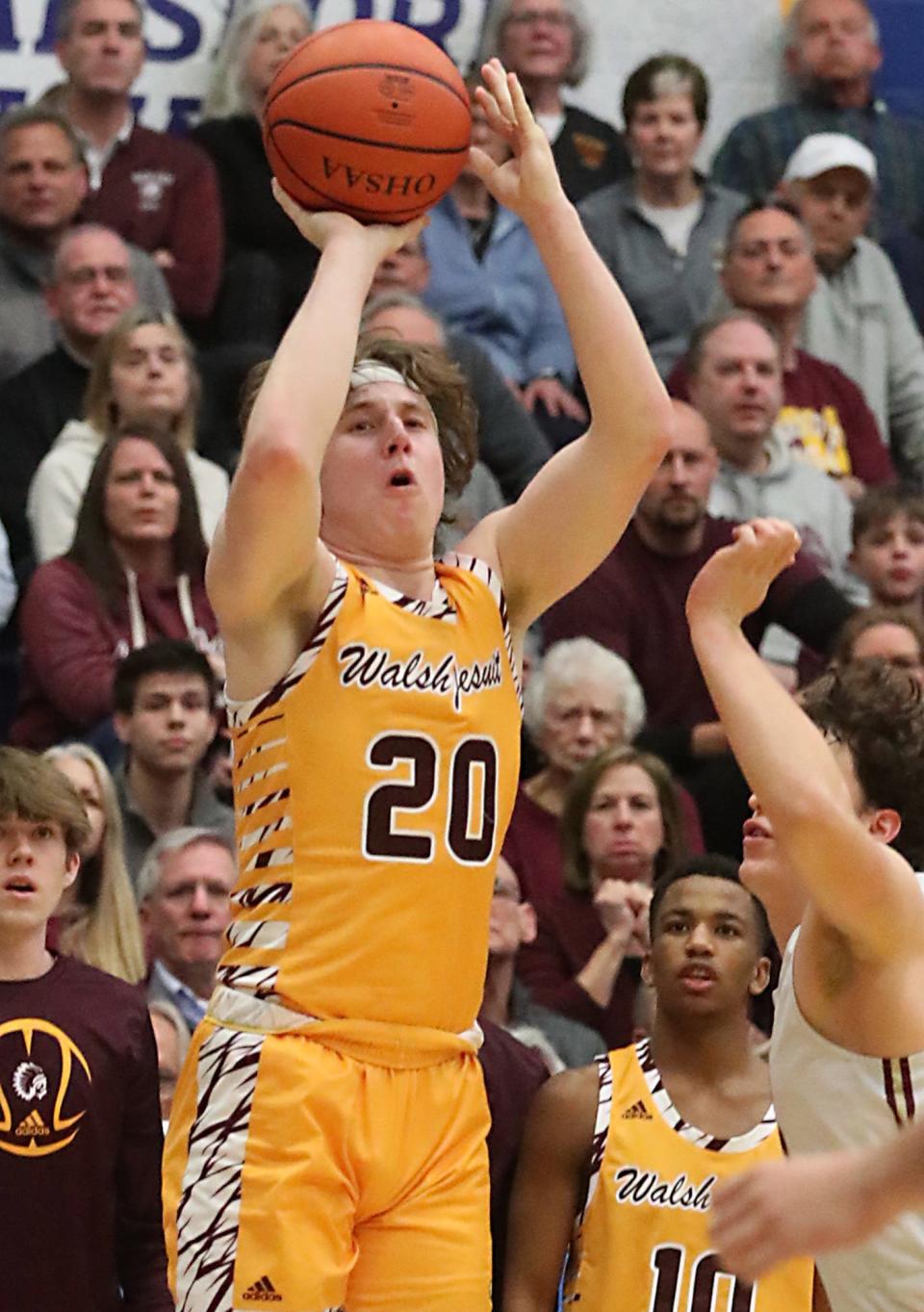 Walsh Jesuit's Zach Halligan shoots against Stow during the Div. I regional semifinal boys basketball game at The Kent State University MAC center on Wednesday in Kent. Walsh beat Stow 63-61  in overtime.