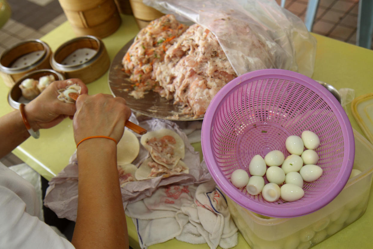 A chef preparing food at a restaurant at the Lavender Food Centre.(File photo by: Jeff Greenberg/UIG via Getty Images)