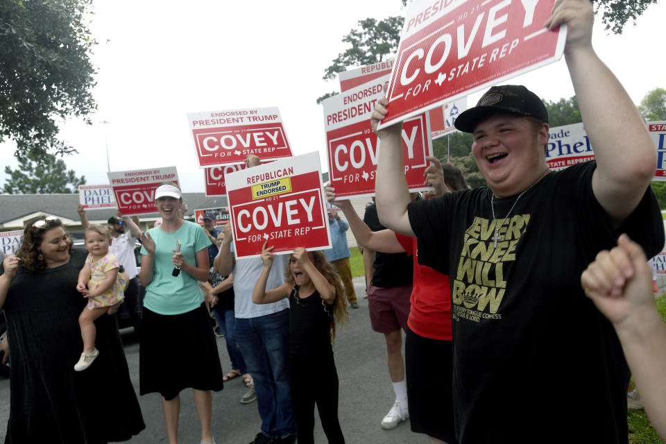 Supporters of David Covey, a candidate for Texas State House District 21, chant while he makes a poll stop at the Raymond Gould Community Center in Vidor, Texas, Tuesday, May 28, 2024. (Kim Brent/The Beaumont Enterprise via AP)