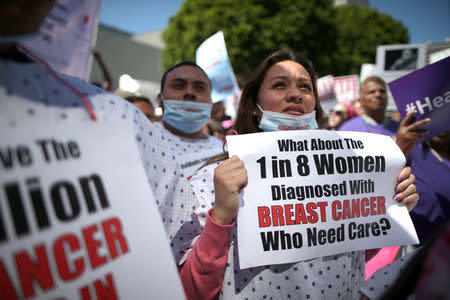 People march in a "Save Obamacare" rally on the seventh anniversary of Obamacare's signing, in Los Angeles, California, U.S. March 23, 2017. REUTERS/Lucy Nicholson