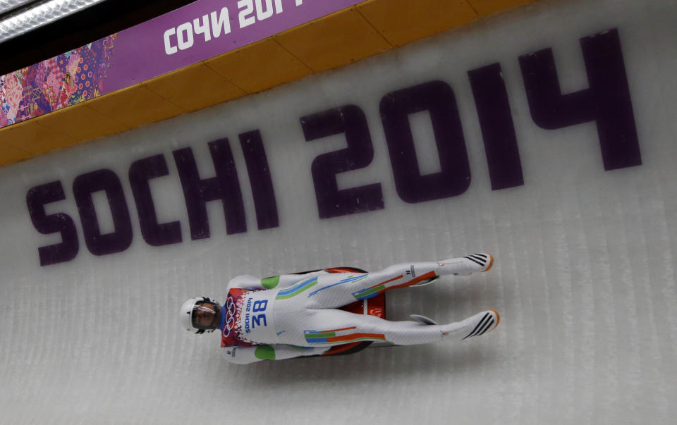 Shiva Keshavan, who if from India but is competing under the Olympics flag, takes turn five in the third run during the men's singles luge final at the 2014 Winter Olympics, Sunday, Feb. 9, 2014, in Krasnaya Polyana, Russia. (AP Photo/Dita Alangkara)