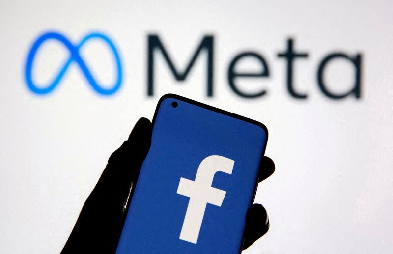 FILE PHOTO: FILE PHOTO: A smartphone with Facebook's logo is seen in front of displayed Facebook's new rebrand logo Meta in this illustration