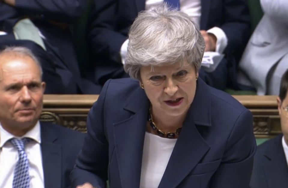 In this grab taken from video, Britain's Prime Minister Theresa May speaks during Prime Minister's Questions in the House of Commons, London, Wednesday July 17, 2019. (House of Commons/PA via AP)