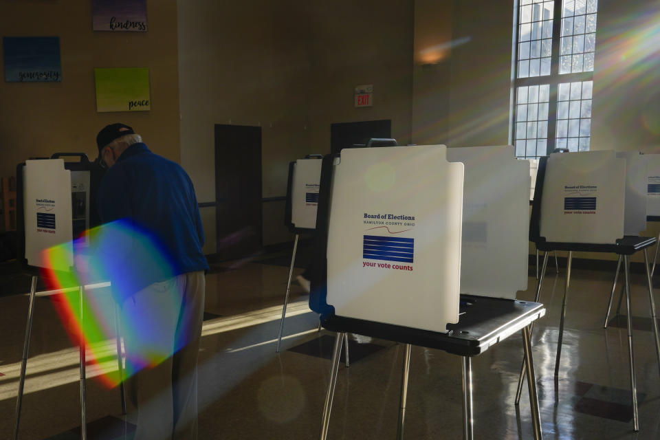 Morning light streams in as a voter fills out their Ohio primary election ballot at a polling location in Knox Presbyterian Church in Cincinnati, Ohio, on Tuesday, March 19, 2024. (AP Photo/Carolyn Kaster)