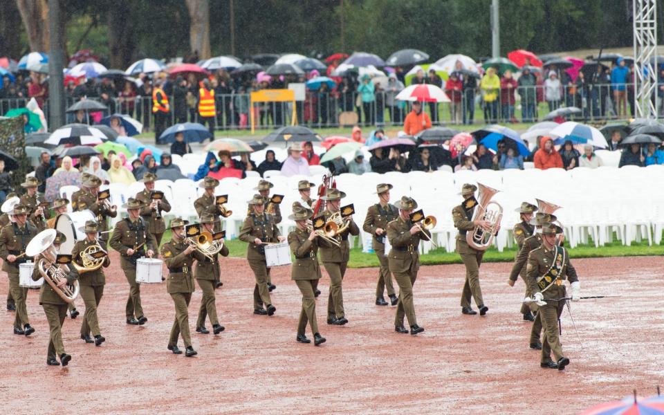 A military band marches during the National Ceremony held at the Australian War Memorial in Canberra - Credit: Barcroft