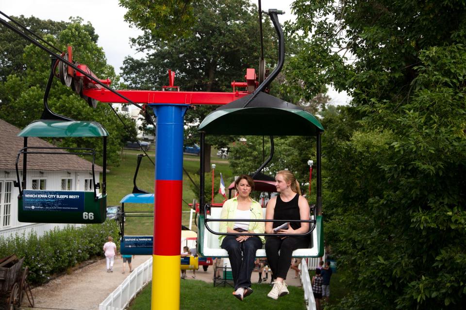 U.S. Sen. Amy Klobuchar, D-Minn., does an interview with Des Moines Register reporter Shelby Fleig on the Sky Glider at the Iowa State Fair on Saturday, Aug. 10, 2019, in Des Moines. 