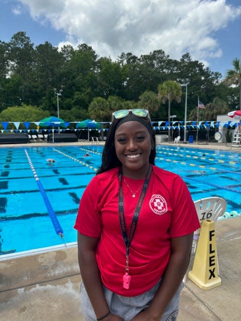 Camille Montgomery picture in front of Trousdell Aquatic Center's lap pool