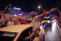 Supporters of Ekrem Imamoglu, the candidate of the secular opposition Republican People's Party, CHP, celebrate in central Istanbul, Sunday, June 23, 2019. In a blow to Turkish President Recep Tayyip Erdogan, Imamoglu declared victory in the Istanbul mayor's race for a second time Sunday after Binali Yildirim, the government-backed candidate conceded defeat in a high-stakes repeat election. (AP Photo/Lefteris Pitarakis)