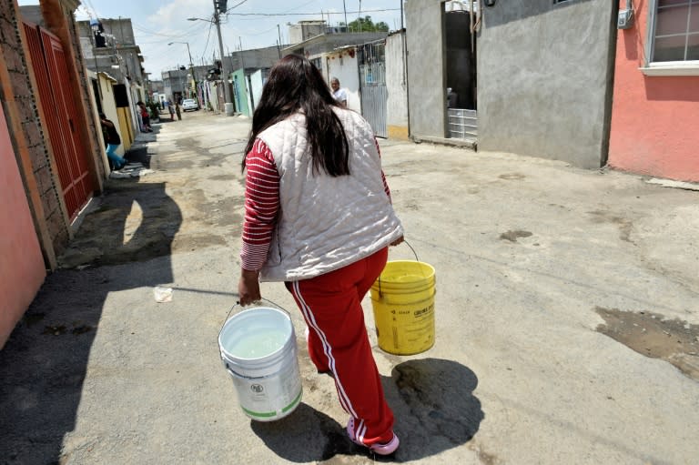 Residents of Iztapalapa, Mexico City have to carry water home in buckets due to a lack of infrastructure
