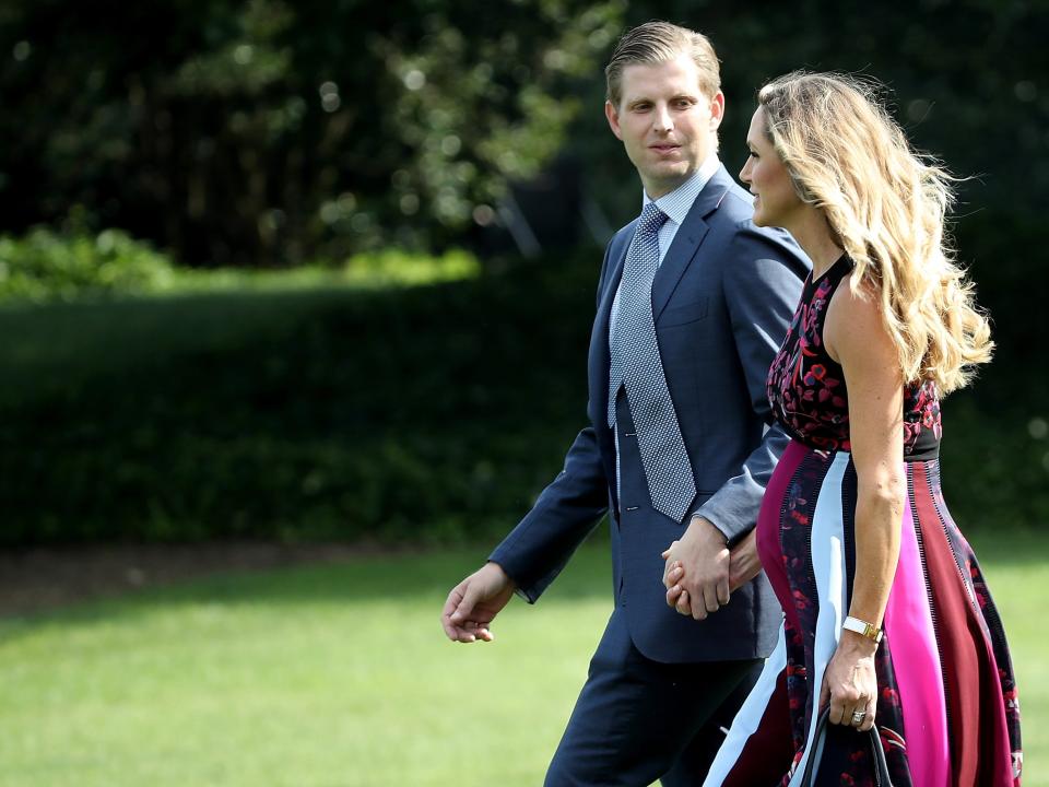 Eric and Lara Trump, who is pregnant, walk to Marine One on the White House lawn