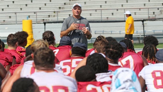 ULM offensive coordinator Rich Rodriguez addresses the team after Friday's practice. Rodriguez will serve as interim head coach while Terry Bowden is away.