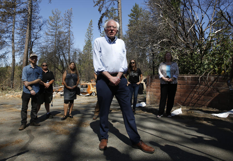 Democratic presidential candidate Sen. Bernie Sanders, I-Vermont, talks to reporters as he tours a mobile home park that was destroyed by last year's wildfire in Paradise, Calif., Thursday, Aug. 22, 2019. Sanders released a $16.3 trillion climate plan Thursday that builds on the Green New Deal and calls for the United States to move to renewable energy across the economy by 2050 and declare climate change a national emergency. (AP Photo/Rich Pedroncelli)