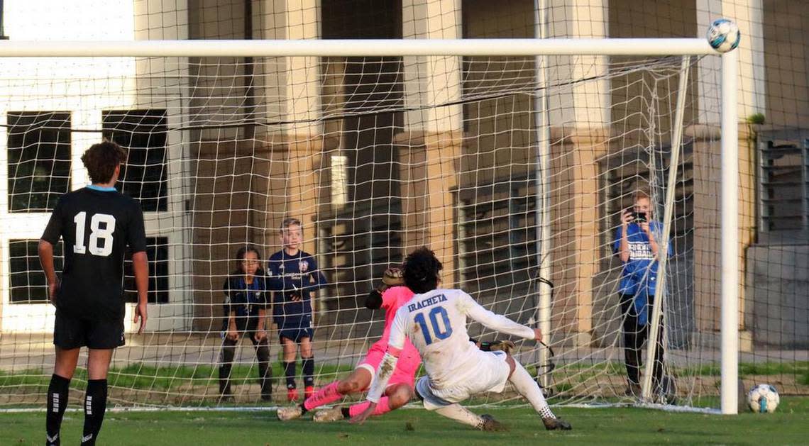 A penalty kick taken by Clovis High senior midfielder Kobe Iracheta sails high and wide in the final minute of a TRAC match against Clovis North at Clovis Community College on Jan. 18, 2023. The Broncos improved to 14-0-1 with the 2-1 victory.