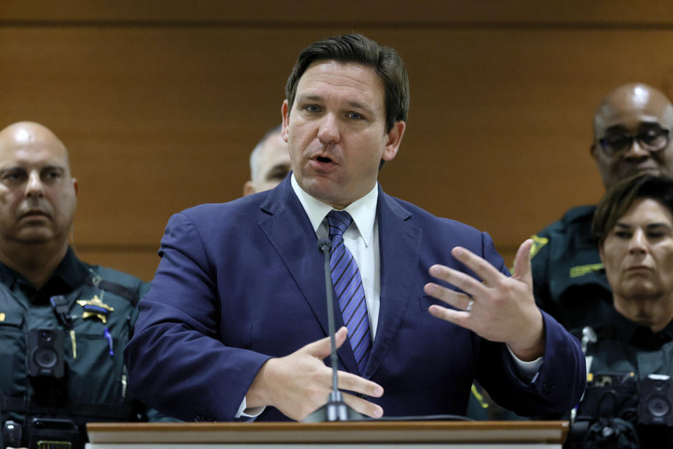 Florida Gov. Ron DeSantis speaks during a news conference at the Broward County Courthouse in Fort Lauderdale, Fla. on Thursday, Aug. 18, 2022. Florida Gov. Ron DeSantis on Thursday announced criminal charges against 20 people for illegally voting in 2020, the first major public move from the Republican's new election police unit. (Amy Beth Bennett/South Florida Sun-Sentinel via AP)