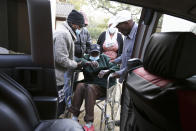 An elderly man prepares to be transported to hospital at the Society for the Destitute Aged care home in Harare's Highfiled township, Tuesday, June, 22, 2021. The economic ravages of COVID-19 are forcing some families in Zimbabwe to abandon the age-old tradition of taking care of their older people. Some roam the streets. The lucky ones end up at facilities for older people. They were once widely viewed by many Zimbabweans as “un-African” and against the social bonds that have held extended families together for generations. (AP Photo/Tsvangirayi Mukwazhi)