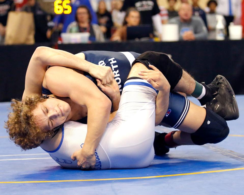 Edmond North's Jude Randall wrestles Stillwater's Landyn Sommer in the Class 6A 165-pound finals match at the state tournament on Feb. 25 at State Fair Arena.