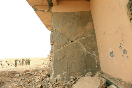 Remains of wall panels and colossal statues of winged bulls, destroyed by Islamic State militants are seen in the Assyrian city of Nimrud eastern bank of the Tigris River, south of Mosul, Iraq, November 16, 2016. REUTERS/Ari Jalal
