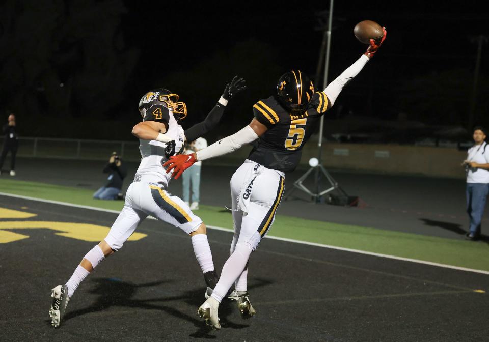 Newbury Park's Landon Bell stretches to makes a one-handed touchdown catch while Ventura's Ryder Koontz defends during a CIF-SS Division 5 first-round playoff game on Nov. 3.