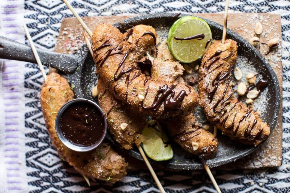 <p>Half Baked Harvest</p><p>Any food tastes better when it's on a stick and dipped in chocolate.</p><p><strong>Get the recipe: <a href="https://www.halfbakedharvest.com/banana-fritters-stick-peanut-sugar-mexican-chocolate-sauce/" rel="nofollow noopener" target="_blank" data-ylk="slk:Banana Fritters On A Stick With Peanut Sugar + Mexican Chocolate Sauce;elm:context_link;itc:0;sec:content-canvas" class="link ">Banana Fritters On A Stick With Peanut Sugar + Mexican Chocolate Sauce</a></strong></p>