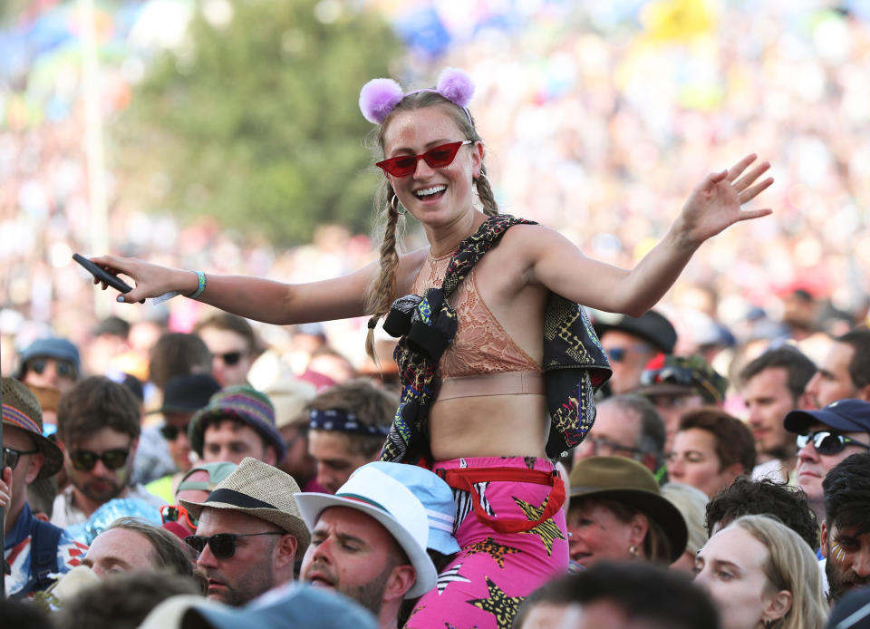 A member of the crowd watches Lauryn Hill performing on the Pyramid Stage during the Glastonbury Festival at Worthy Farm in Pilton, Somerset.