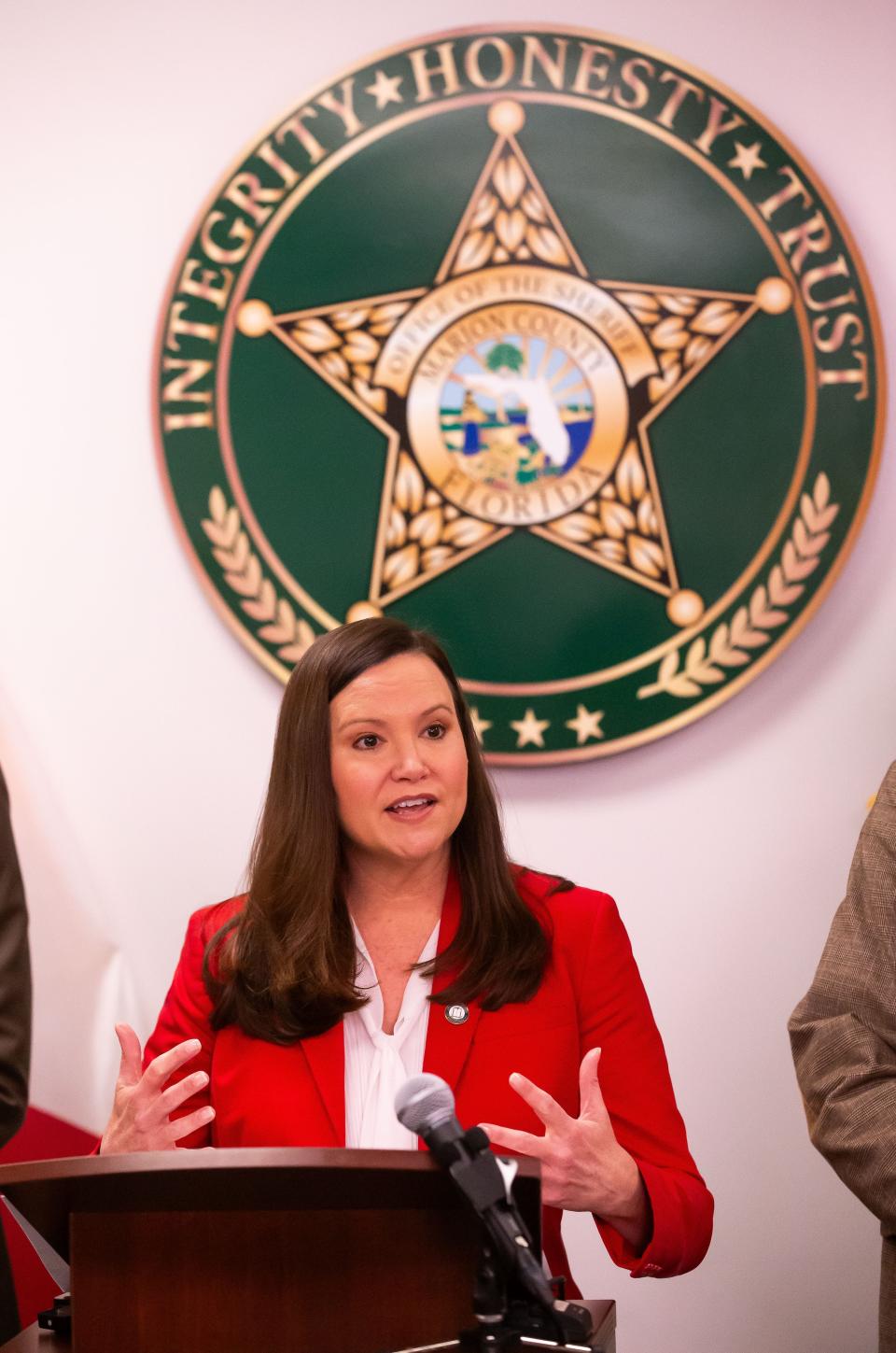 Florida Attorney General Ashley Moody, center, speaks about the massive influx of illicit fentanyl into the United States, during a press conference on Thursday in Ocala.