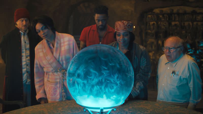 This image released by Disney Enterprises shows, from left, Owen Wilson, Rosario Dawson, LaKeith Stanfield, Tiffany Haddish and Danny DeVito in a scene from “Haunted Mansion.”