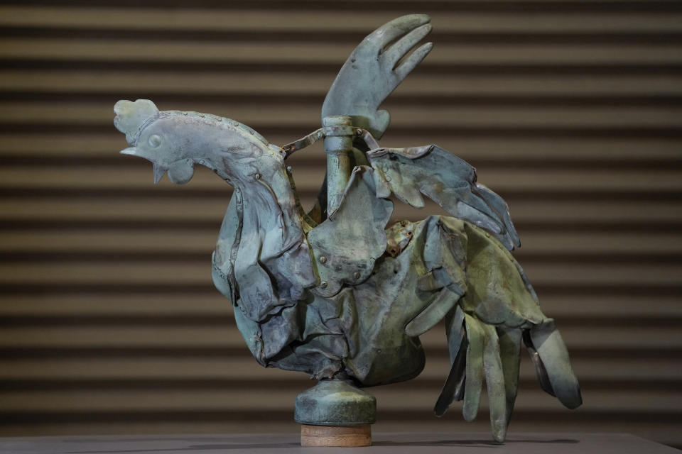 The rooster which sat atop of the spire of the Notre-Dame cathedral is seen at the Cité de l'architecture et du patrimoine, in Paris, Friday, Dec. 15, 2023. Roosters are a symbol of France. The small bird that adorned Notre Dame plunged to the ground in the April 2019 fire that collapsed the spire and consumed the roof. (AP Photo/Thibault Camus)