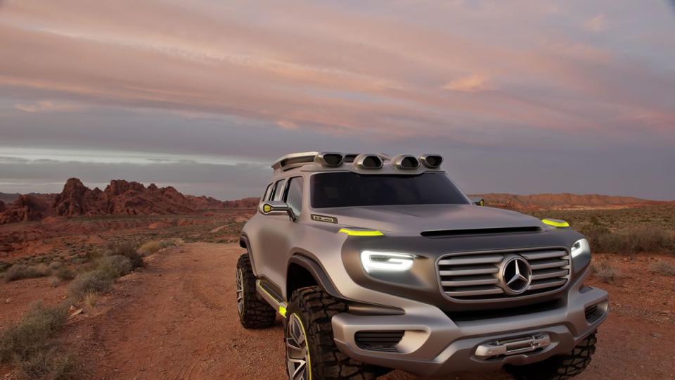 a silver mercedes benz energ force concept sits on a desert road, featuring a boxy profile but curvy details