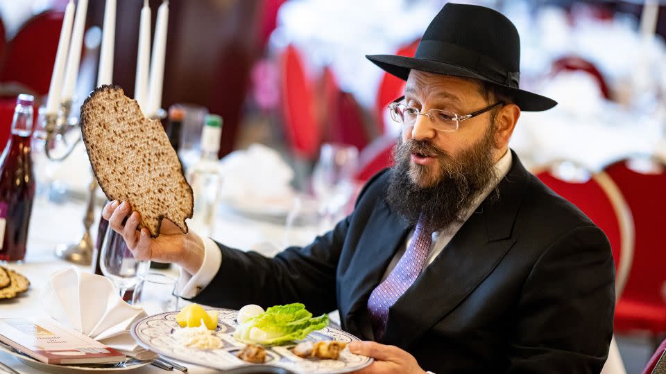 Rabbi Yehuda Teichtal, chairman of the Chabad Jewish Educational Center in Berlin, prepares matzos and the Seder plate at the beginning of Passover. - Fabian Sommer/dpa/picture alliance/Getty Images