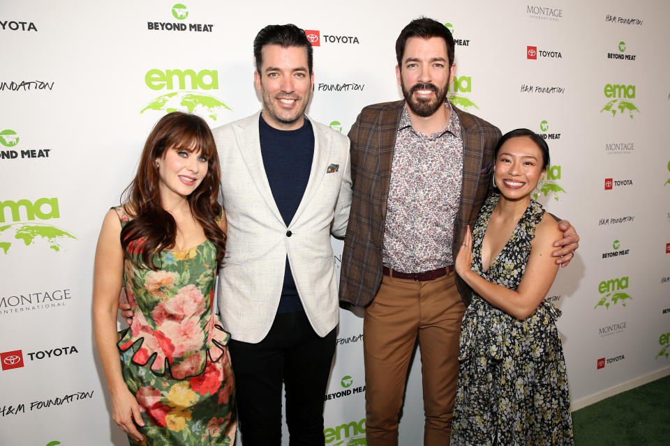 VAN NUYS, CALIFORNIA - OCTOBER 16: (L-R) Zooey Deschanel, Jonathan Scott, Drew Scott, and Linda Phan attend the EMA Awards Gala sponsored by Beyond Meat, H&M Foundation, Montage International, and Toyota on October 16, 2021 in Van Nuys, California. (Photo by Jesse Grant/Getty Images for Environmental Media Association)