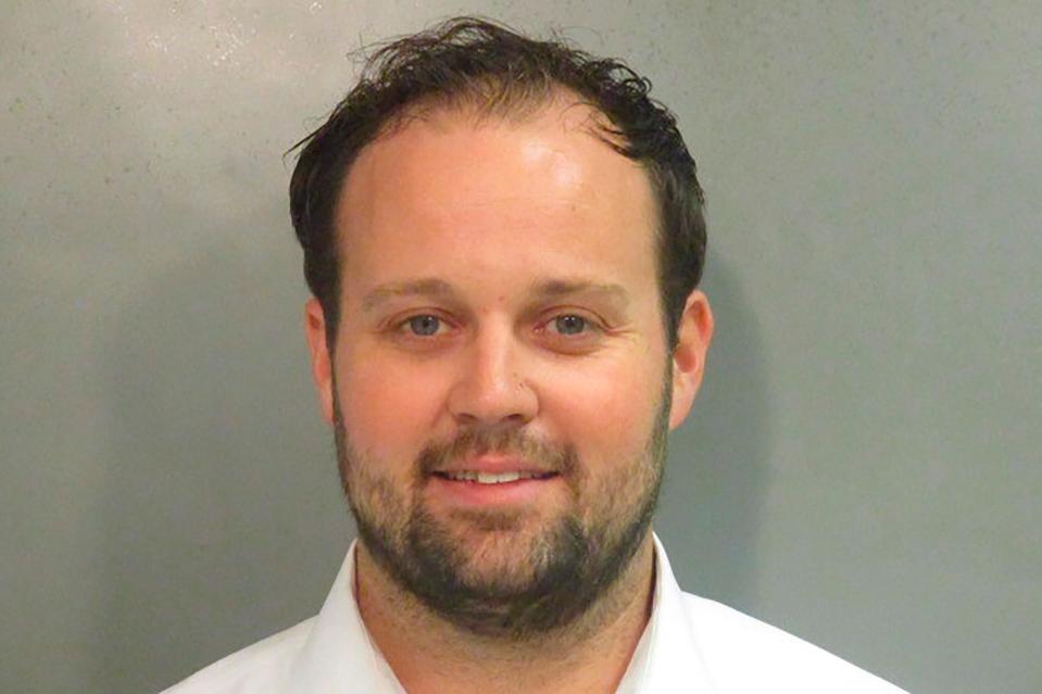 This undated photo provided by Washington County (Ark), Detention Center shows Josh Duggar. A federal judge has sentenced reality TV’s Duggar to about 12 1/2 years in prison for his conviction on one count of receiving child pornography. Prosecutors had asked the court to sentence the former “19 Kids and Counting” star on Wednesday, May 25, 2022, to the maximum 20 years. (Washington County Detention Center via AP) ORG XMIT: NYPS205