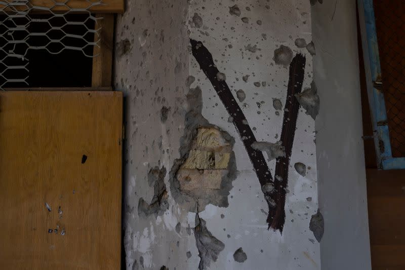 Destroyed building marked with the ‘V’ symbol is pictured, as Russia's attack on Ukraine continues, near Borodianka