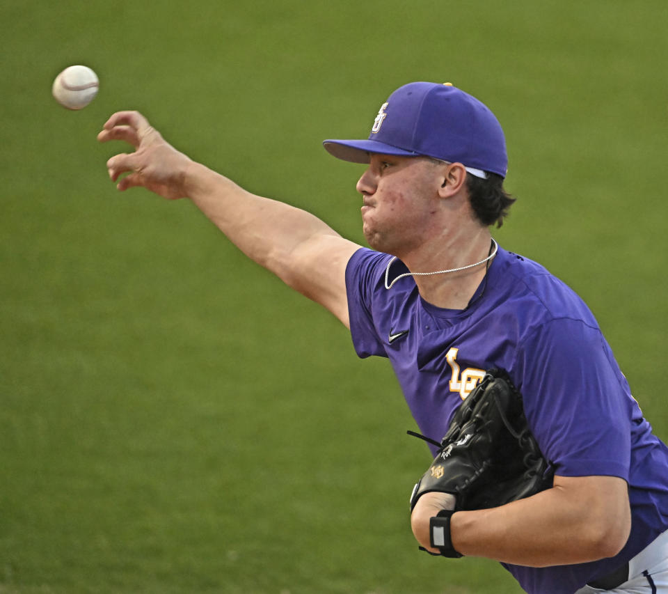 LSU starting pitcher Paul Skenes (20) warms up in the bullpen before the Tigers host Tennessee in an NCAA college baseball game Thursday, March 30, 2023, at Alex Box Stadium on the campus of LSU in Baton Rouge, La. The LSU Tigers enter the NCAA baseball tournament with the top two prospects in this summer's major baseball draft spearheading their postseason push. Centerfielder Dylan Crews is hitting .420 and was named the SEC player of the year. He's the consensus top prospect in this July's amateur draft. Next is 6-foot-6, 247-pound pitcher and Air Force transfer Paul Skenes. The righty throws 100 miles per hour, leads the nation with 167 strikeouts and was named SEC pitcher of the year. (Hilary Scheunuk/The Times-Picayune/The New Orleans Advocate via AP)