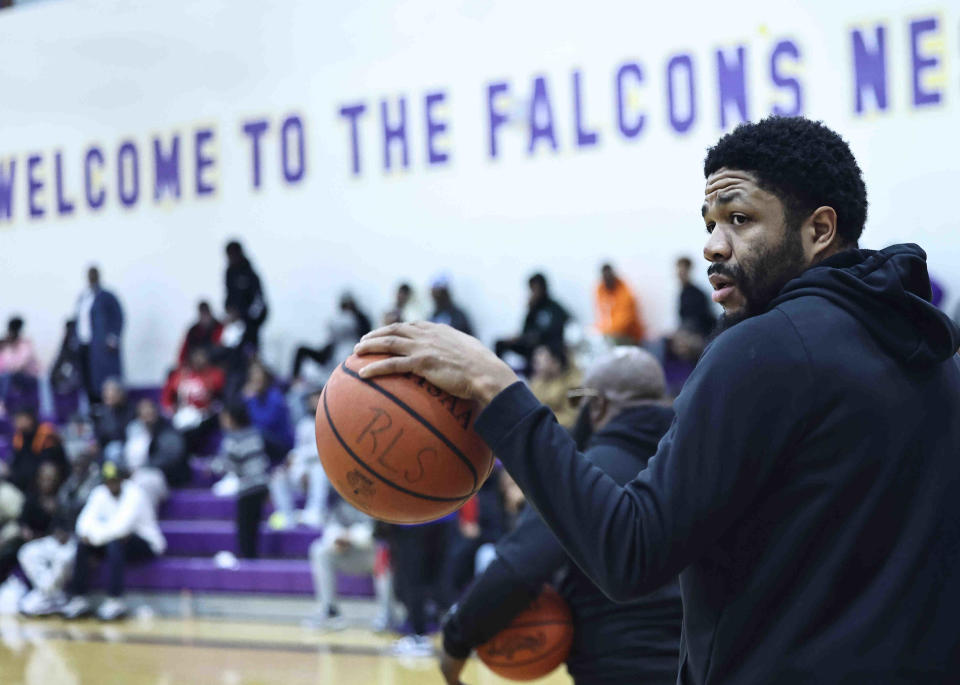 Aiken assistant coach Cordero Stewart during the Falcons basketball game against Withrow Friday Feb 2, 2024.