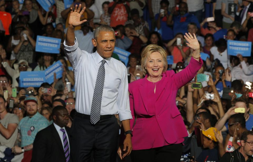 President Obama stands with Democratic presidential candidate Hillary Clinton during a Clinton campaign event in Charlotte, N.C., on Tuesday. (Photo: Brian Snyder/Reuters)