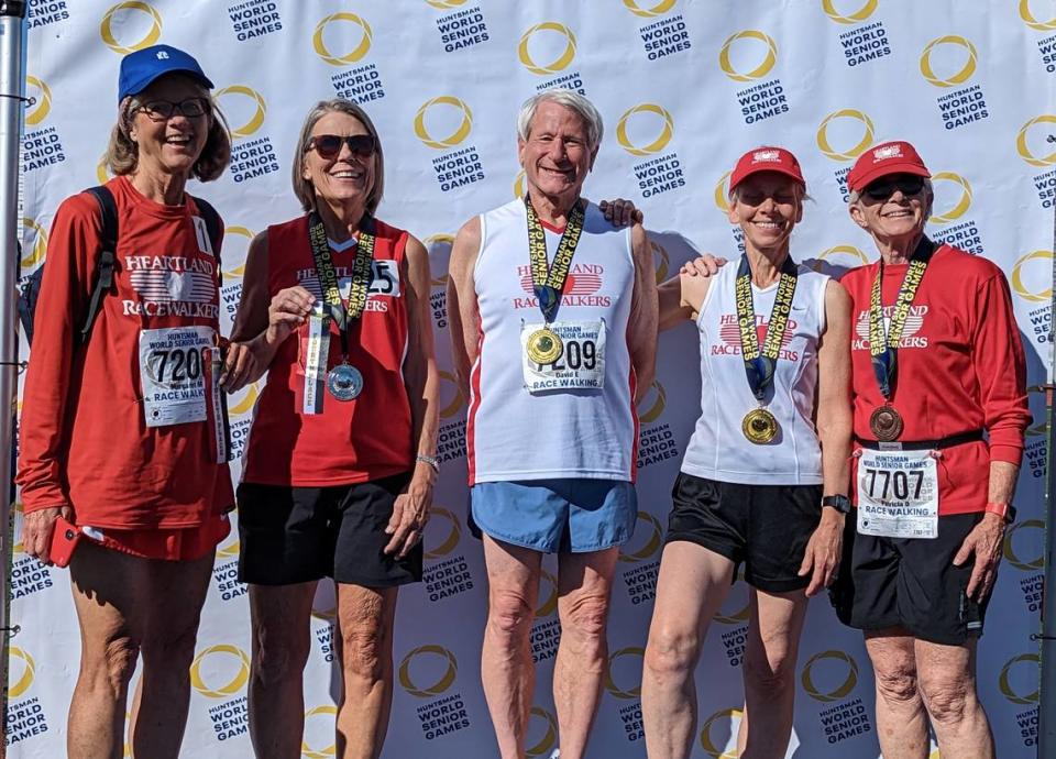 David Eisenberg, who won a medal at the Huntsman World Games in Utah, is surrounded by fellow race-walkers. From left, Maggie McCoy, Janice Kelble, Eisenberg, Martha McCarter, Pat Durkin.