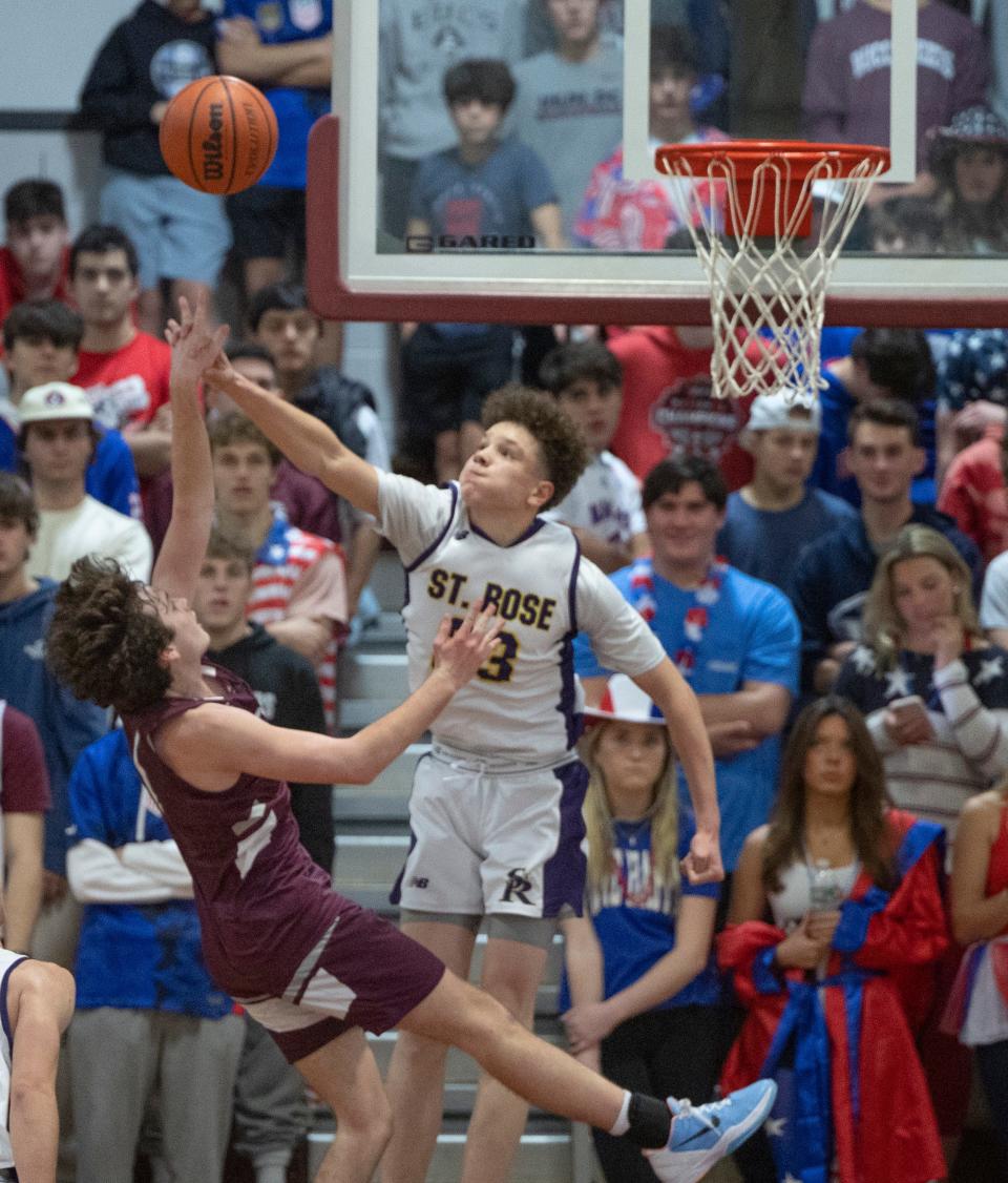 St. Rose's Jayden Hodge goes up to block a shot by Red Bank's Braydon Kirkpatrick during the Buc Classic at Red Bank Regional on Dec. 30, 2022.