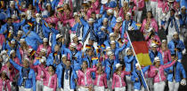 Germany's Natascha Keller carries the flag during the Opening Ceremony at the 2012 Summer Olympics, Friday, July 27, 2012, in London. (AP Photo/Paul Sancya)