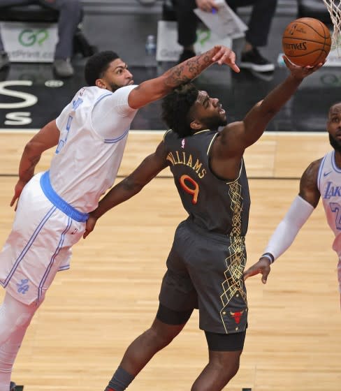 Lakers forward Anthony Davis tries to block a shot by Bulls forward Patrick Williams on Jan. 23, 2021.