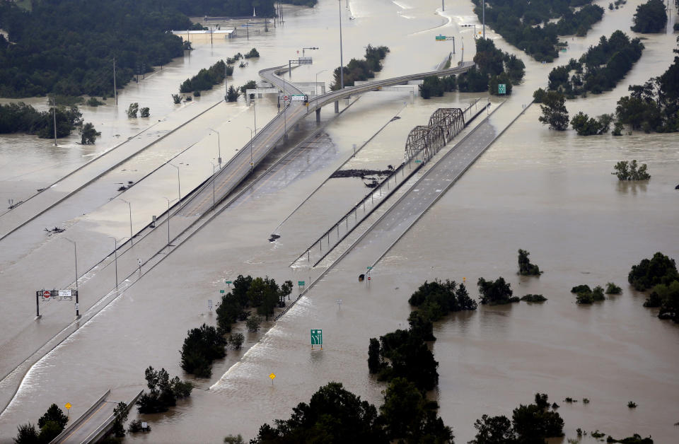 <span class="s1">Interstate 69 is covered by water at the San Jacinto River bridge in Humble, Texas, on Aug. 29. (Photo: David J. Phillip/AP)</span>