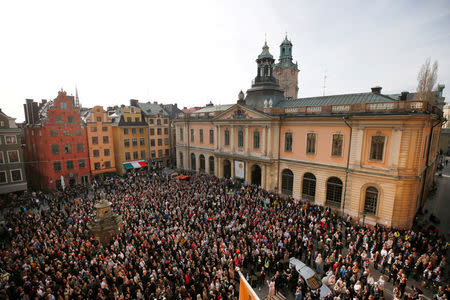 FILE PHOTO: Participants in a manifestation show their support for former Academy member and Permanent Secretary Sara Danius who stepped down last week, in Stortorget square in Stockholm, Sweden April 19, 2018. TT News/Fredrik Persson/via REUTERS/File Photo