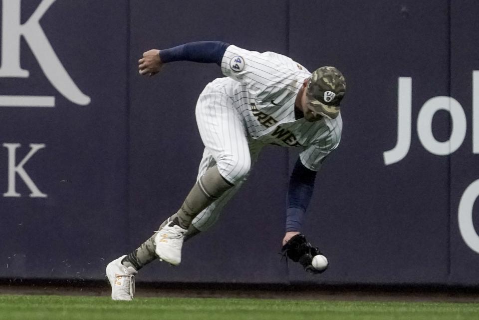 Milwaukee Brewers' Avisail Garcia makes a catch on a ball hit by Atlanta Braves' Freddie Freeman during the third inning of a baseball game Friday, May 14, 2021, in Milwaukee. (AP Photo/Morry Gash)