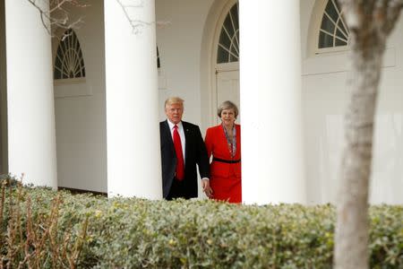 U.S. President Donald Trump escorts British Prime Minister Theresa May after their meeting at the White House in Washington, U.S., January 27, 2017. REUTERS/Kevin Lamarque