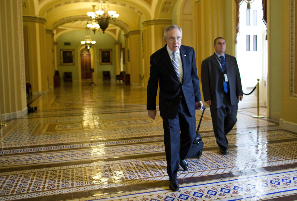 Senate Majority Leader Sen. Harry Reid, D-Nev., walks to his office after arriving on Capitol Hill on Wednesday, Oct. 16, 2013 in Washington. (AP Photo/ Evan Vucci)