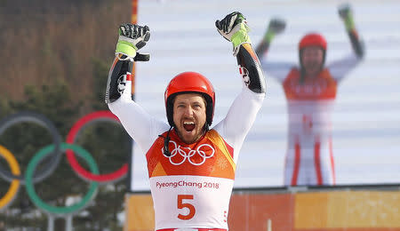 Alpine Skiing - Pyeongchang 2018 Winter Olympics - Men's Giant Slalom - Yongpyong Alpine Centre - Pyeongchang, South Korea - February 18, 2018 - Marcel Hirscher of Austria reacts during the victory ceremony. REUTERS/Leonhard Foeger