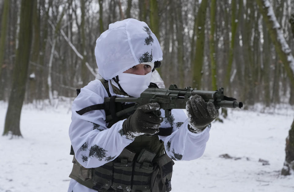 A member of Ukraine's Territorial Defense Forces, volunteer military units of the Armed Forces, trains in a city park in Kyiv, Ukraine, Saturday, Jan. 22, 2022. Dozens of civilians have been joining Ukraine's army reserves in recent weeks amid fears about Russian invasion. (AP Photo/Efrem Lukatsky)