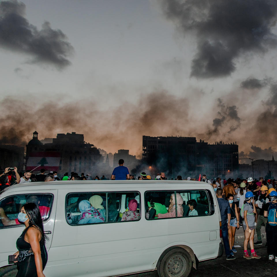 A group of women inside a van avoid thick clouds of tear gas in Beirut on Aug. 8. | Myriam Boulos for TIME