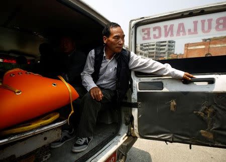 The body of Nepali mountain climber Min Bahadur Sherchan, 85, is kept inside an ambulance as it arrives at a hospital after he died on Saturday, at base camp while on his attempt to become the oldest person to climb Mount Everest, in Kathmandu, Nepal May 7, 2017. REUTERS/Navesh Chitrakar