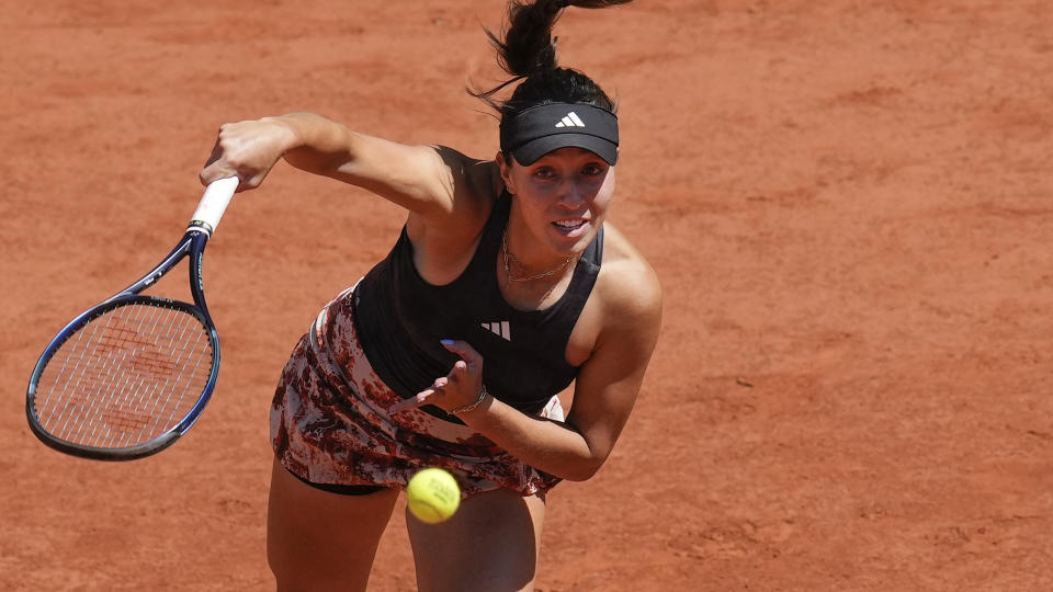 FILE - Jessica Pegula, of the U.S, serves against Italy's Camilla Giorgi during their second round match of the French Open tennis tournament at the Roland Garros stadium in Paris, May 31, 2023. The group that runs the French Open tennis tournament has hired an artificial intelligence company to monitor players' social media accounts in a bid to try to protect athletes from cyberbullying. (AP Photo/Christophe Ena, File)